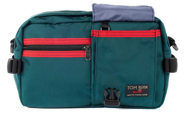 The LGD in Seapine/Red/Dawn. Front view, front buckle pocket lifted up to show the Dawn lining.